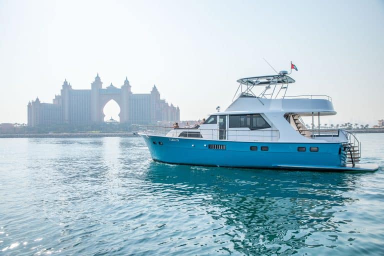 66ft Voyage rental yacht cruising Dubai coastline, 23 guests